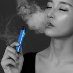 Women exhaling a vape cloud from blue KiwiPod buy vape shop auckland and online vape deliveries