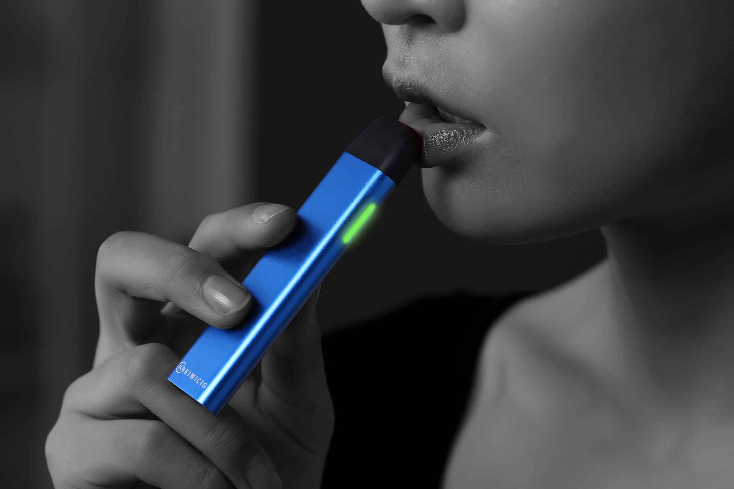 Women with blue Vape pod buy vape shop auckland and online vape deliveries