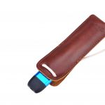 A Blue KiwiPod vape device in a Leather pouch