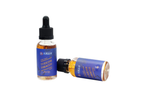 2 bottle of Turkish tobacco vape juice, 1 stand up right and 1 lying down